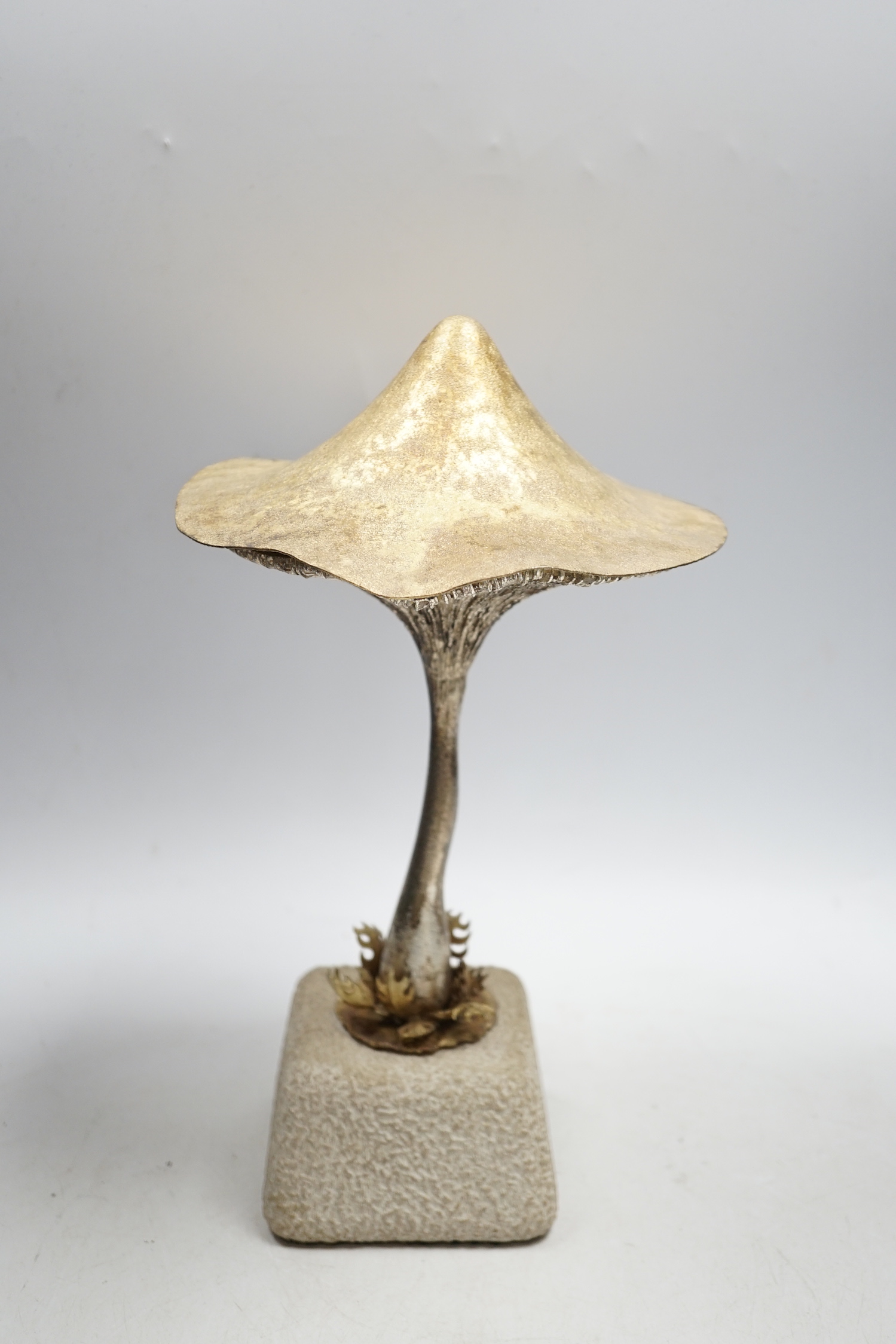 An Elizabeth II limited edition novelty surprise mushroom, by Christopher Nigel Lawrence, London, 1976, opening to reveal a pixie fishing, no.2/8, on a simulated rock base, overall height 29.5cm, with certificate.